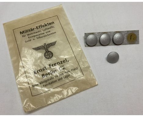 4 WWII style German army buttons in wax packet.  