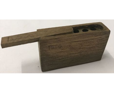 A WWII style German stick grenade primer box with sliding lid.  Approx. 5.5cm x 9cm x 2.5cm.