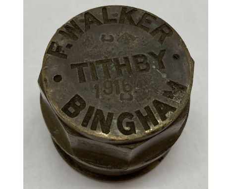 A WWII style cart wheel hub F. Walker, Tithby, Bingham impressed to top with war department arrow marks and date. 