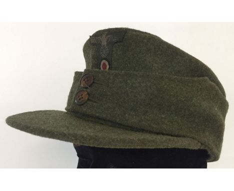 A WWII style German army M42 field/ski cap. With early button design.  