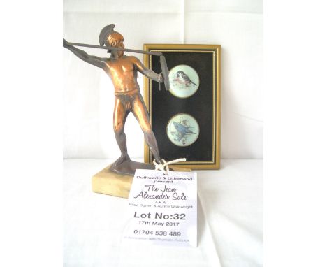 Framed Staffordshire enamel bird plaque and a metal figure of a Roman.