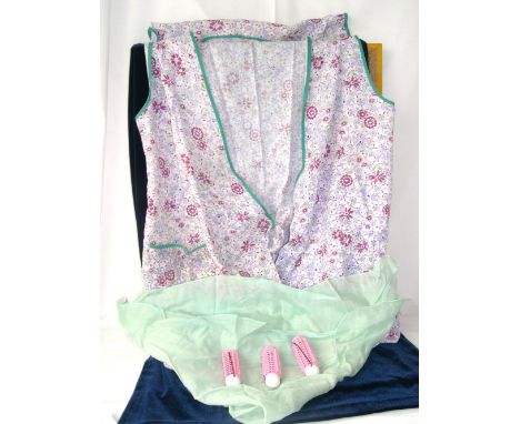 The original curlers, scarf and pinafore, as worn by Hilda Ogden in Coronation Street with a plastic bag labelled in Jean's h