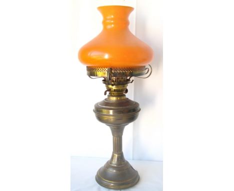 Reproduction brass oil lamp with shade.