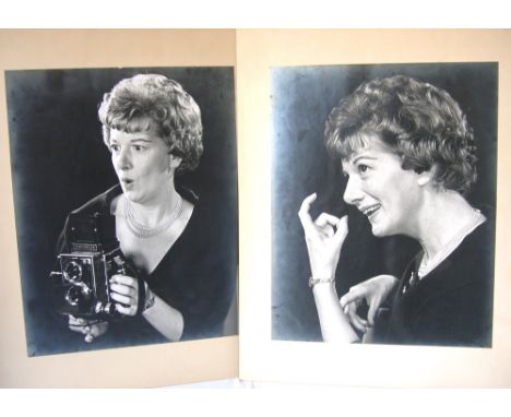 Black and white photograph of Jean Alexander holding a camera and a companion study.