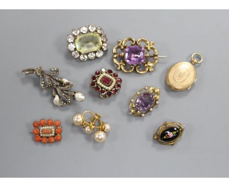 Two early 20th century amethyst brooches, five other brooches including Victorian garnet and coral, a pair of earrings and an