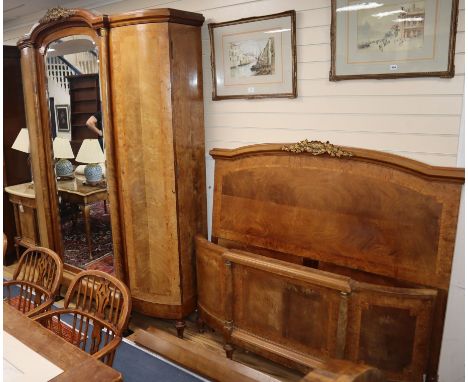 An early 20th century French tulip-banded walnut three piece bedroom suite comprising mirrored 'knockdown' armoire, 4'6" bedf