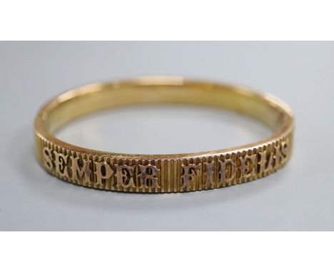 A yellow metal hinged bangle, inscribed 'Semper Fidelis'.