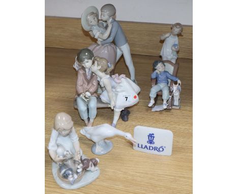 Three Lladro children, two Lladro children groups, a Lladro plaque and a goose (7)