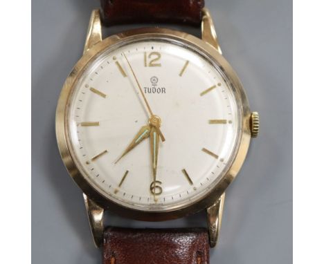 A gentleman's 1960's 9ct gold Tudor manual wind wrist watch, with later associated leather strap.