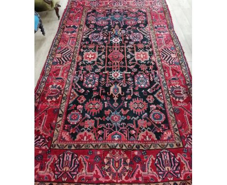 A Hamadan red ground carpet 330 x 200cm