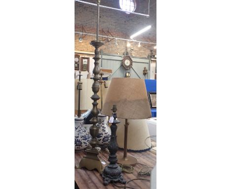 A BRASS ALTAR STYLE LAMP BASE 142 cms height, a moulded composition lamp base and a wooden lamp (3)