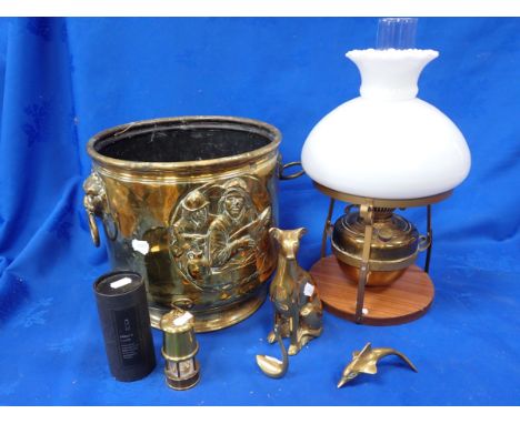 AN EMBOSSED BRASS COAL BIN with an oil lamp, a miniature miner's lamp and brass ornaments