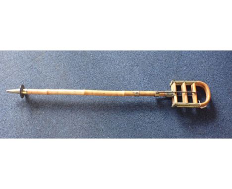 A CANE AND BRASS FOLDING SHOOTING STICK 