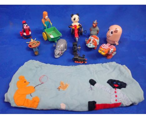 A COLLECTION OF VINTAGE CLOCKWORK TOYS both tinplate and plastic, including a ''Hector's wheelbarrow' (Hector's House) a Japa
