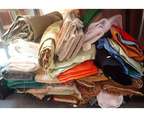 A LARGE QUANTITY OF VINTAGE AND RETRO FABRICS including green corded velvet, coloured felt etc.