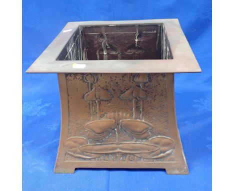 AN ART NOUVEAU BRASS JARDINIERE of swept tapering square form, with broad flat rim, embossed with stylised waterlilies, unmar