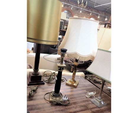 A CORINTHIAN STYLE TABLE LAMP BASE black and gold together with three other similar lamp bases