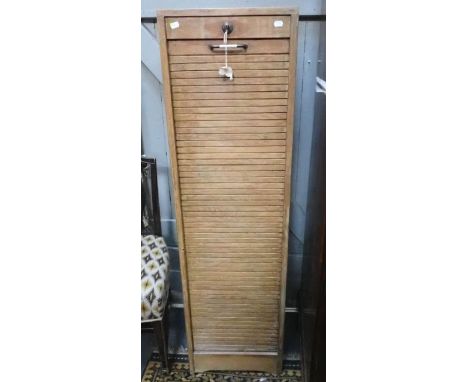 A LIGHT OAK TAMBOUR FRONTED OFFICE CABINET with working lock and key, early 20th century, 40cm wide 142cm high (some general 
