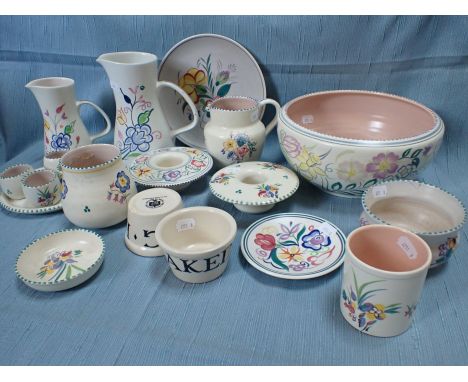 A COLLECTION OF POOLE POTTERY traditionally decorated, including an egg cup set, and two Bridgewater 'BAKED EGG' pots (one a/