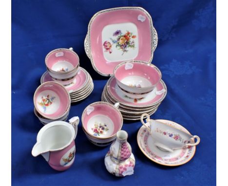 A TEA SERVICE FOR SIX , WITH FLOWERS WITHIN A PINK BORDER 20th century continental, with a Royal Doulton cup and stand, and a