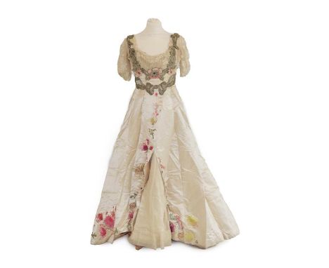 A Late 19th Century Ladies' Evening Dress, in cream silk with short net and lace pleated sleeves, floral appliqués in silk an