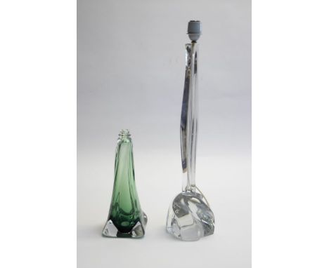Daum France; a mid 20th Century glass lamp base in clear glass, signed, together with a Val St Lambert green and clear glass 