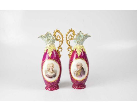 A pair of Continental gilt-heightened ewers, each decorated with a vignette portrait, one of a portly gentleman with various 