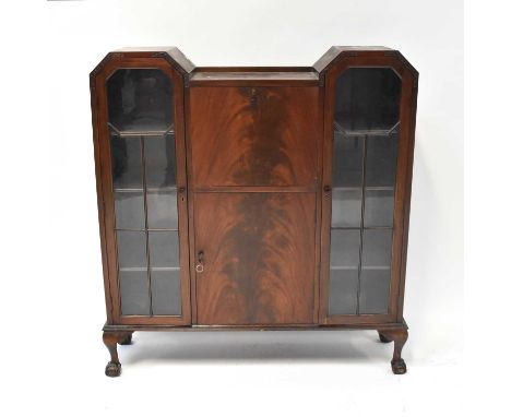 An early 20th century mahogany bureau bookcase, the central fall-front section fitted with simple fitted interior, above a pa