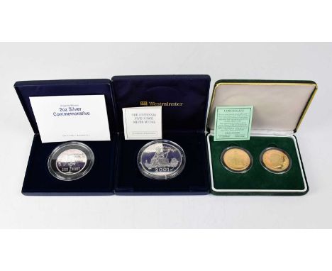 Three cased presentation coins, comprising a Westminster 'Britannia Five Ounce Silver Medal' commemorating the Bicentenary of