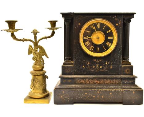 A Victorian black slate Romanesque-style mantel clock, the black dial set with gilt Roman numerals, with Corinthian columns a