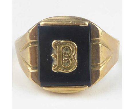A gentlemen's 10k signet ring with black onyx panel inset with letter 'B', size R, approx. 4.2g.Condition Report: Shank is mi