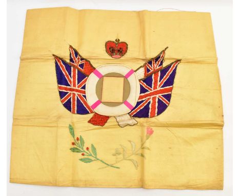 A Trench Art embroidered photograph frame featuring Union flags either side of a life ring, under a crown, the square section