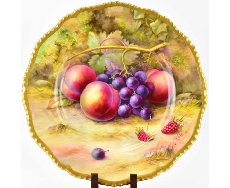 ROYAL WORCESTER; an early 20th century hand painted plate by T. Lockyer, depicting fallen ripe fruit, peaches, grapes and ber