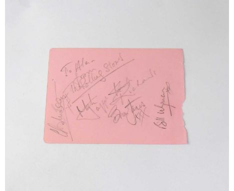 THE ROLLING STONES; a torn page from an autograph album bearing the signatures of Mick Jagger, Bill Wyman, Brian Jones, and C