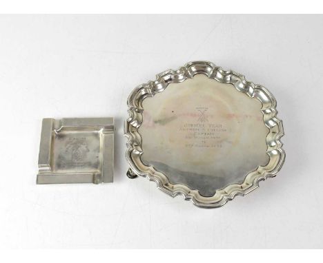 THOMAS BRADBURY &amp; SONS LTD; a George V hallmarked silver dumb waiter of shaped form, raised on three scrolling supports, 