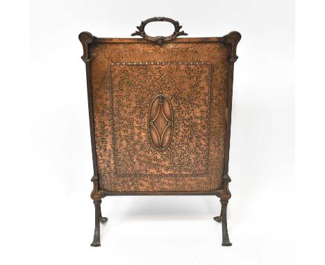 An early 20th century brass fire screen with carrying handle and central motif, on splayed feet, 71 x 47cm.