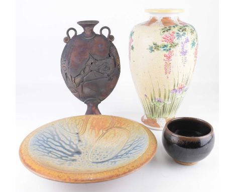 Three items of studio pottery comprising an oil spot glazed bowl, marked Ben Evans, 8.5 x 11cm, an Evans studio pottery foote