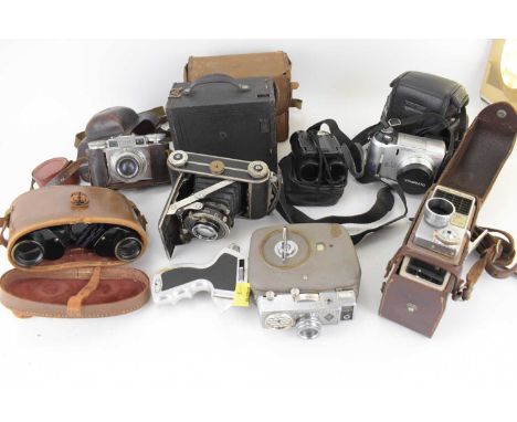 A collection of various vintage cameras, binoculars and cine cameras, to include an Agfa Movex 88L cine camera, a Bell &amp; 