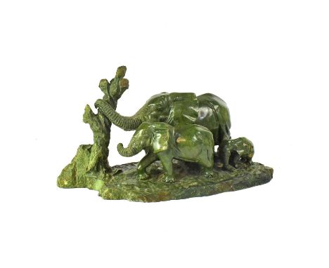 PAUL K. GALLE; a carved malachite figure group of three elephants by a tree, on naturalistic base, signed and dated '87, heig