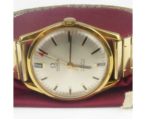 TITUS; a gentlemen's vintage wristwatch, the circular silvered dial set with numerals at 6 and 12 o'clock, raised baton numer