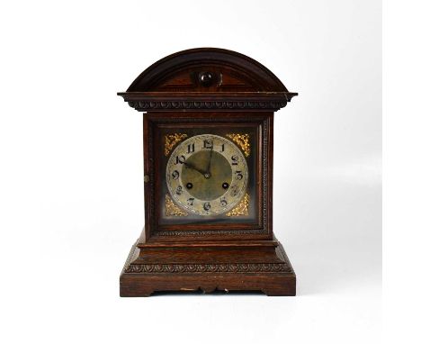 WOOD BROS; an early 20th century oak cased twin fusee mantel clock, the arched pediment above 6.5" brass dial with silvered c
