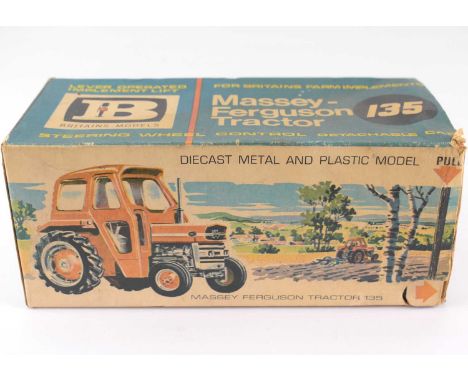 BRITAINS; a boxed 9529 Massey Ferguson 135 tractor.Condition Report: playworn, window of the cab has a crack which has been g