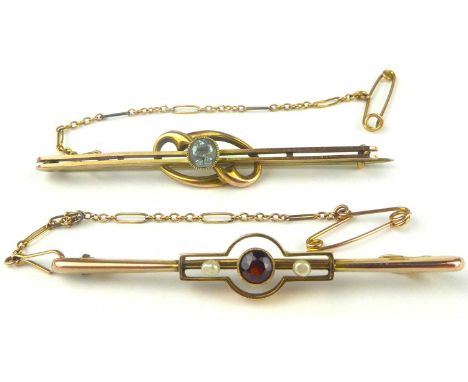 Two 9ct gold bar brooches, one a bezel set light blue stone in a split bar, length 5.5cm, the other a bezel set ruby flanked 