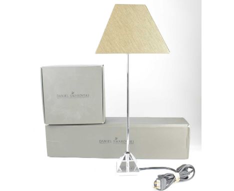 DANIEL SWAROVSKI; a boxed 'Luxor' table lamp and separate Swarovski brown fabric lampshade, height of lamp 41cm.Condition Rep