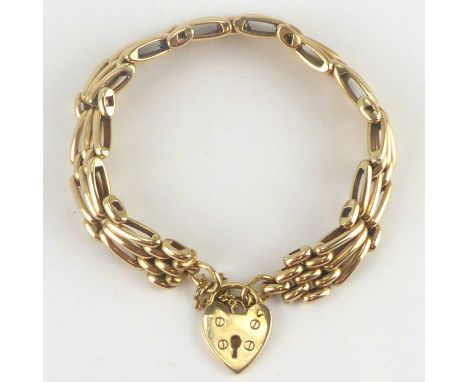 A 9ct gold three bar gate bracelet with a 9ct gold heart-shaped padlock clasp, length 19cm, approx. 35.4g.