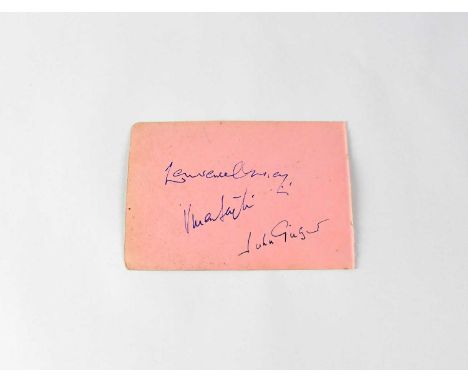 A torn page from an autograph book bearing signatures of iconic film stars Lawrence Olivier, Vivien Leigh, and John Gielgud, 