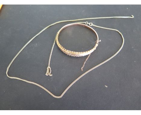 A 9ct gold bangle - dented and a broken 9ct chain - total weight approx 12 grams