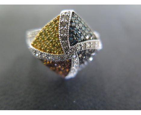 A 9ct white gold ring with four panels of coloured diamonds - approx weight 4.96 grams - ring size N/O - some light scratches