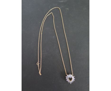 A 9ct gold tanzanite and diamond pendant on chain - weight approx 5.5 grams - good condition
