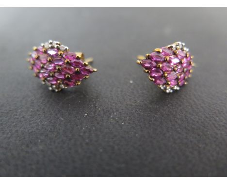 A pair of 9ct gold ruby and diamond earrings - weight approx 4 grams - good condition